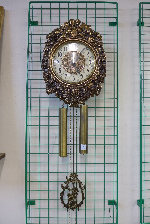 A French gilt metal cherub wall clock