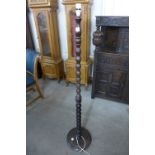 A wooden standard lamp