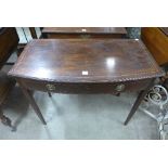 A George III inlaid mahogany bow front single drawer side table