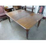 A Victorian mahogany extending dining table