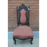 A Victorian carved ebonised side chair