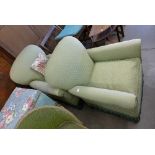 A pair of early 20th Century armchairs upholstered in green fabric