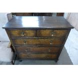 An oak chest of five drawers