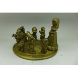 A novelty brass Snow White and the seven dwarfs figure