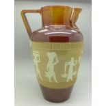 A Doulton stoneware jug with pharaoh head spout and Egyptian figures,