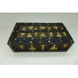 A porcupine quill box and an incomplete set of dominoes