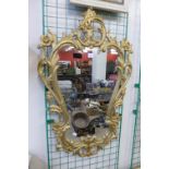 A rococo style gilt framed mirror