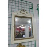 A cream and parcel gilt framed mirror