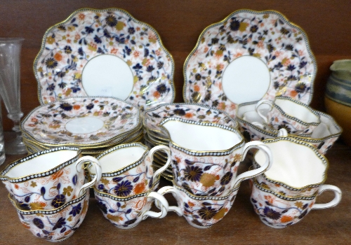 Coalport Imari pattern teawares, comprising eleven saucers and side plates, nine cups,