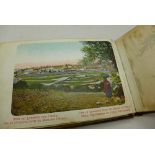 An olive wood Jerusalem album with pressed flowers and postcard views of the city