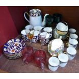 A Limoges coffee set, lacking one saucer, a Sutherland Imari six setting coffee set,