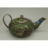 A miniature enamel teapot