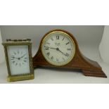 A brass cased and four glass sided clock and a Comitti of London battery operated clock (2)