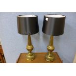 A pair of French gilt metal table lamps