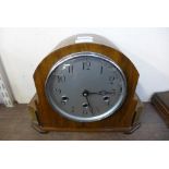 A walnut mantel clock