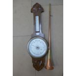 A carved oak aneroid barometer and a copper hunting horn