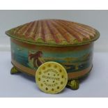 A Huntley and Palmer novelty shell shaped biscuit tin decorated with a mermaid and fish plus a