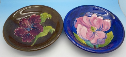 Two Moorcroft dishes including hibiscus with brown background,