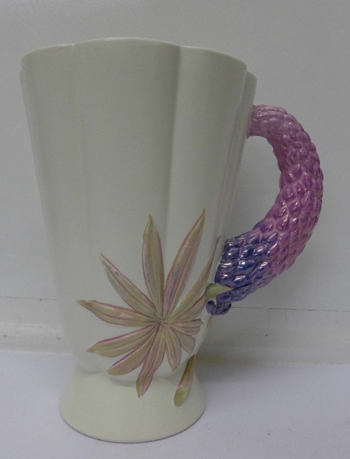 A Clarice Cliff Lupin vase, 20.