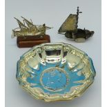 A continental silver dish set with a Maria Theresia coin and two silver model boats