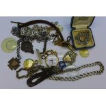 A silver Albert chain, a silver fob, other chains, etc.