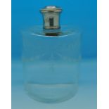 A French silver topped glass scent bottle with stopper and etched decoration, 14.