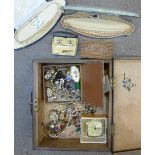 A wooden work box with costume jewellery including two cased sets of simulated pearls and a