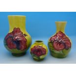 Three Moorcroft vases, hibiscus on yellow ground,