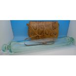 An early 20th Century glass rolling pin and a snakeskin handbag