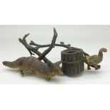 A cold painted inkwell, fox stalking a duck,