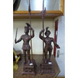 A pair of metal models of Spanish soldiers