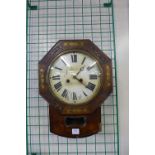 An early Victorian rosewood and brass inlaid drop dial wall clock