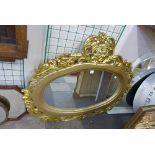 A reproduction French Louis XV style gilt framed mirror