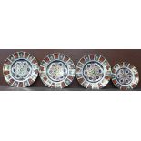 Three Royal Crown Derby Imari 1128 dinner plates and a medium plate,