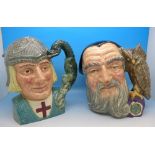 Two large Royal Doulton character jugs, Merlin and St.