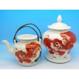 A Qing red dog decorated teapot and caddy,