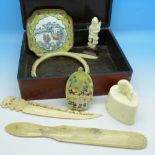 A carved ivory bangle, bone items, a box,
