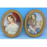 A pair of painted portrait miniatures in oval frames, height of frames 11.