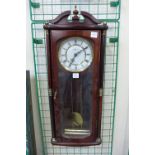 A Highlands mahogany wall clock