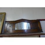 An oak overmantel mirror