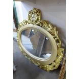 A reproduction French Louis XV style gilt framed mirror