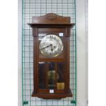 A mahogany wall clock