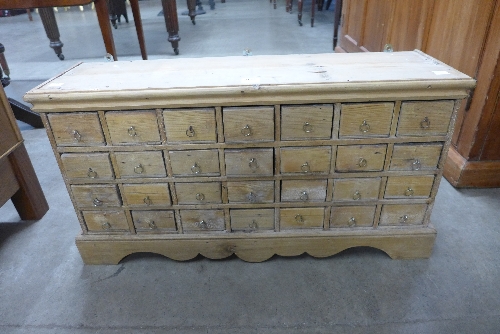 A set of pine spice drawers