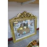 A reproduction French Louis XV style gilt framed mirror