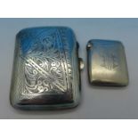 A silver cigarette case and a silver vesta case hallmarked Birmingham 1900,