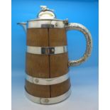 An oak and silver plate ale jug with lid,