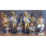 Six German novelty resin figures and four Black Forest carved wooden figures