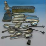 A silver pepper, a silver cigarette case, silver spoons, a pair of silver sugar bows, etc.