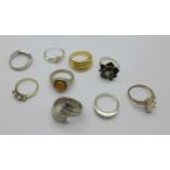 Nine silver and white metal rings