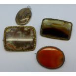 Three agate set brooches and a pendant